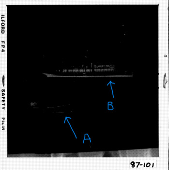 photocopy of 1 /4 negatives showing a pilot being rowed out to AKUNA 1.