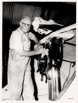 Bill Mouchmore cleaning the steering wheel of the QUEENSCLIFFE life-boat.