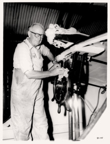 Bill Mouchmore cleaning the steering wheel of the QUEENSCLIFFE life-boat.
