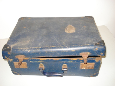 A Large Vintage Tan Leather Suitcase With Chrome Studs