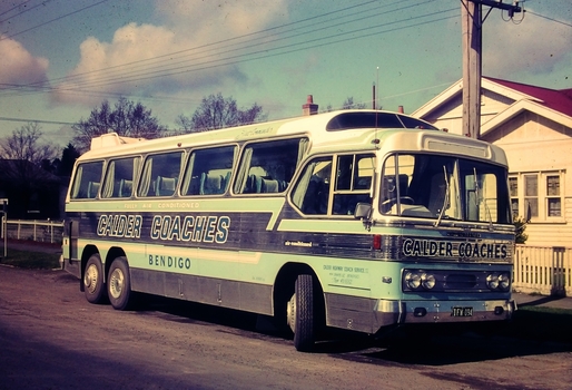 Calder Coaches Bendigo Bus Registration IFW 094 in front of a house