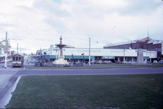 Looking up Mitchell Street, the fountain, an Eaglehawk bound tram and the Fountain Plaza