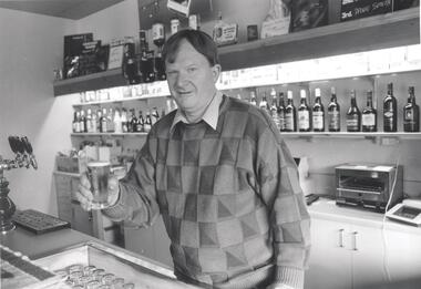 Photograph - PHOTOGRAPH. BARMAN HOLDING A GLASS OF BEER