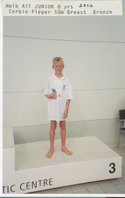 Photograph - VAL CAMPBELL COLLECTION: PHOTOGRAPH OF CORBIN PIEPER ALL JUNIOR 8 YRS 50M BREAST BRONZE AWARD, 2002