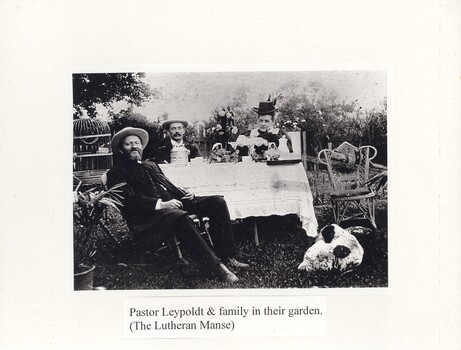 Pastor Leypoldt and family in their garden. (The Lutheran Manse)