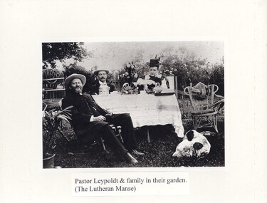 Pastor Leypoldt and family in their garden. (The Lutheran Manse)
