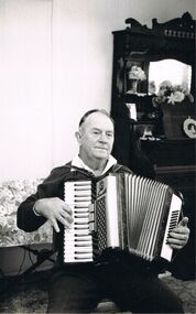 Photograph - PETER ELLIS COLLECTION: BLACK AND WHITE PHOTO MAN PLAYING ACCORDION