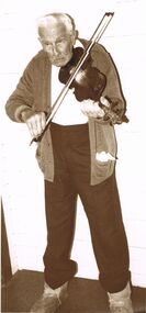 Photograph - PETER ELLIS COLLECTION: ELDERLY MAN PLAYING A FIDDLE, 1st July, 1986