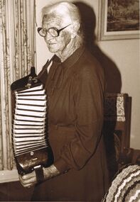 Photograph - PETER ELLIS COLLECTION: LADY PLAYING ACCORDION, May, 1985