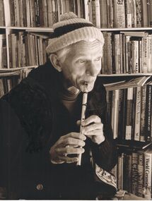 Photograph - PETER ELLIS COLLECTION: MAN PLAYING FLUTE, July, 1986