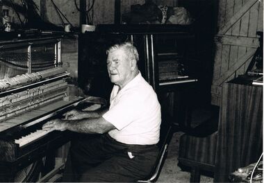 Photograph - PETER ELLIS COLLECTION: MAN PLAYING PIANO