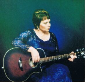 Photograph - PETER ELLIS COLLECTION: WOMAN PLAYING GUITAR