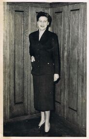 Photograph - BLACK AND WHITE PHOTOGRAPH  FEMALE IN FRONT OF WOOD PANELS