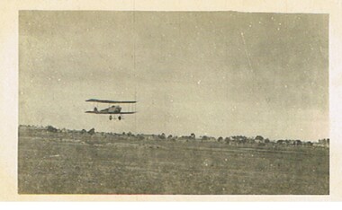 Postcard - BASIL WATSON COLLECTION:  BIPLANE FLYING OVER LAND