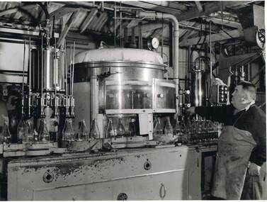 Photograph - COHN BROTHERS COLLECTION: BOTTLE FILLING MACHINE