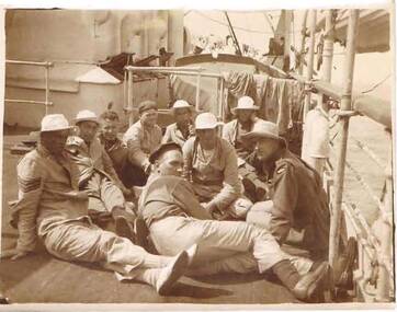 Photograph - ROBERT DENIS KELLY COLLECTION:  GROUP OF MEN RECLINING ON DECK OF SHIP