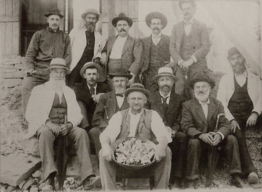 Photograph - GROUP OF MEN WITH CONTAINER OF NUGGETS?