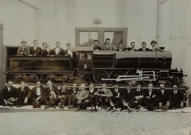 Photograph - GROUP OF MEN WITH MODEL TRAIN OUTSIDE GOLDEN SQUARE DRILL HALL