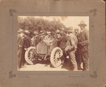Photograph - CAR SURROUNDED BY MEN AND BOYS
