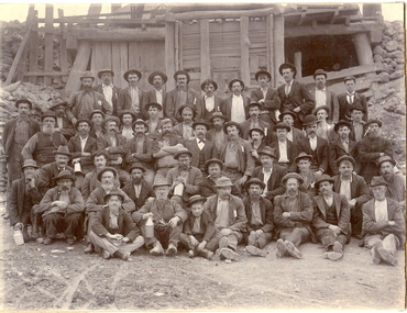 Photograph - GROUP OF WORKMEN IN FRONT OF C.I. BUILDING