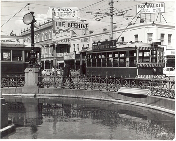 Photograph - BASIL MILLER COLLECTION: TRAMS PASS THE FOUNTAIN