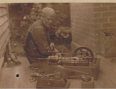 Photograph - MACHINE MODELS AND MAN WITH PIPE