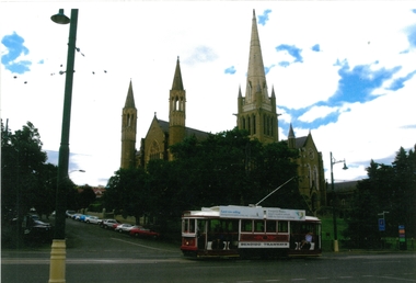 Photograph - JOHN WILLIAMS COLLECTION: TRAM WITH CATHEDRAL IN BACKGROUND