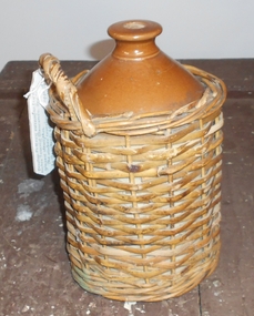Domestic Object - JAMES LERK COLLECTION: BROWN POTTERY DEMI-JOHN, WICKER COVER
