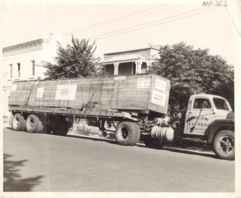 Photograph - YELLOW EXPRESS CARRIERS VEHICLE LOADED WITH MACHINE PARTS
