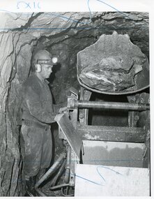 Photograph - AUSTIN COLLECTION: MAN EMPTYING LOADER