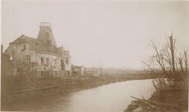 Postcard - ACC LOCK COLLECTION: SEPIA PHOTO OF BOMBED BUILDING BESIDE A RIVER, POSTCARD, 1914-1918