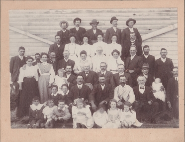 Photograph - Group photograph of a greater family gathering or reunion. Six rows of 45 people from babies to grandparents, August 2024