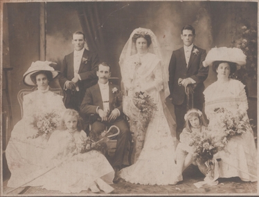 Photograph - Formal photograph of a wedding party with bride and groom, two bridesmaids and best men; and two young girls, August 2024