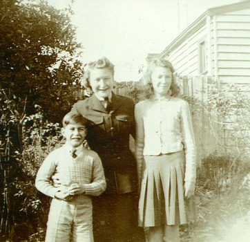 Photo of woman in uniform and two children