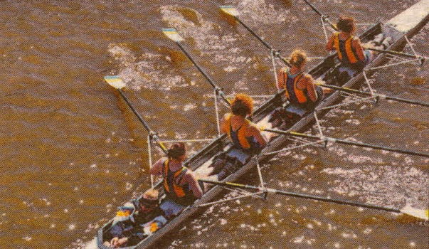 Colour photo of four members in a kayak