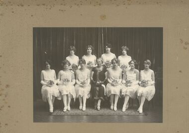 Photograph - Possible Debutant Ball photo - 10 females and older woman in centre