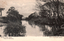 This black-and-white card shows a calm tree-lined creek; on the card is printed “MULLET CREEK, DAPTO. Series 19—Illawarra.”