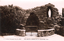 This black-and-white card shows a stone grotto containing a statue of the Virgin Mary; on the card is printed “C. V. Jackson, Newsagent, Yass, No. 6805” and “THE GROTTO, CHURCH OF ST. AUGUSTINE, YASS”.