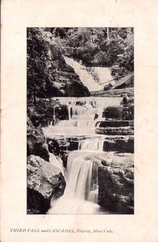 This black-and-white card shows a series of waterfalls cascading over rocky ledges in a forested gorge; on the card is printed “THIRD FALL and CASCADES, Fitzroy, Moss Vale.”