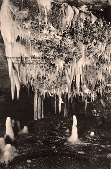 This black-and-white card shows stalactites and mineral formations inside a cave; on the card is printed “GEM OF THE SOUTH, Temple of Baal. Series 31—Jenolan B. Kerry (Copyright), Sydney.”