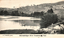 This black-and-white card shows two people in a boat on a river beside a wooded hillside; on the card is printed “A. J. Shearsby, photo.” and “Murrumbidgee River Yeumburra Yass”.