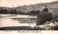 This black-and-white card shows two people in a boat on a river beside a wooded hillside; on the card is printed “A. J. Shearsby, photo.” and “Murrumbidgee River Yeumburra Yass”.