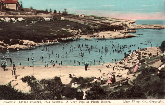 This coloured card shows a crowded coastal swimming cove; on the card is printed “CLOVELLY (LITTLE COOGEE), NEAR SYDNEY. A Very Popular Picnic Resort.” and “[Star Photo. Co., Copyright.”