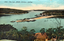 This coloured card shows an elevated view of a harbour, sand spit, wharves and small boats; on the card is printed “1715 - The Spit, Middle Harbour, Sydney.”