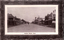This black-and-white card shows a broad commercial street lined with shops and verandahs; on the card is printed “Cooma Street, Yass.”