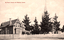This black-and-white card shows a church and adjoining rectory behind trees and a picket fence; on the card is printed “St. Paul’s Church and Rectory, Cooma”.