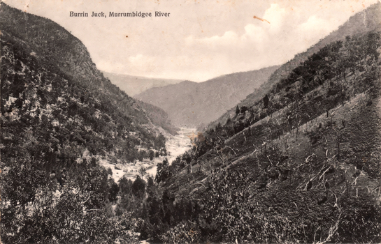 This black-and-white card shows a mountainous river valley; on the card is printed “Burrin Juck, Murrumbidgee River”.