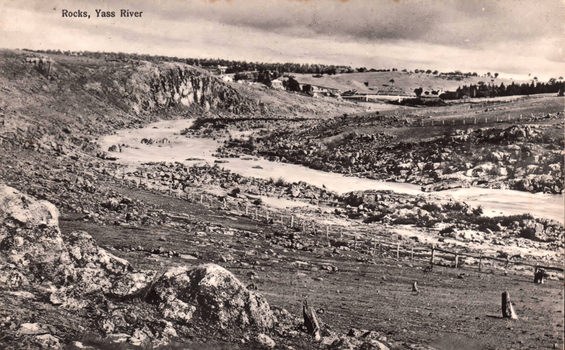 This black-and-white card shows a rocky river landscape; on the card is printed “Rocks, Yass River”.