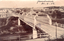 1405.196 This black-and-white card shows a metal bridge crossing a river towards a town. There is no visible printed caption. The handwriting reads: “Yumburra 21-9-03.”