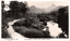 This black-and-white card shows a winding road beside the Tweed River with Mount Warning in the background: On the card is printed “VALENTINE SERIES No. 2697 COPYRIGHT. MT. WARNING & TWEED RIVER, MURWILLUMBAH.”